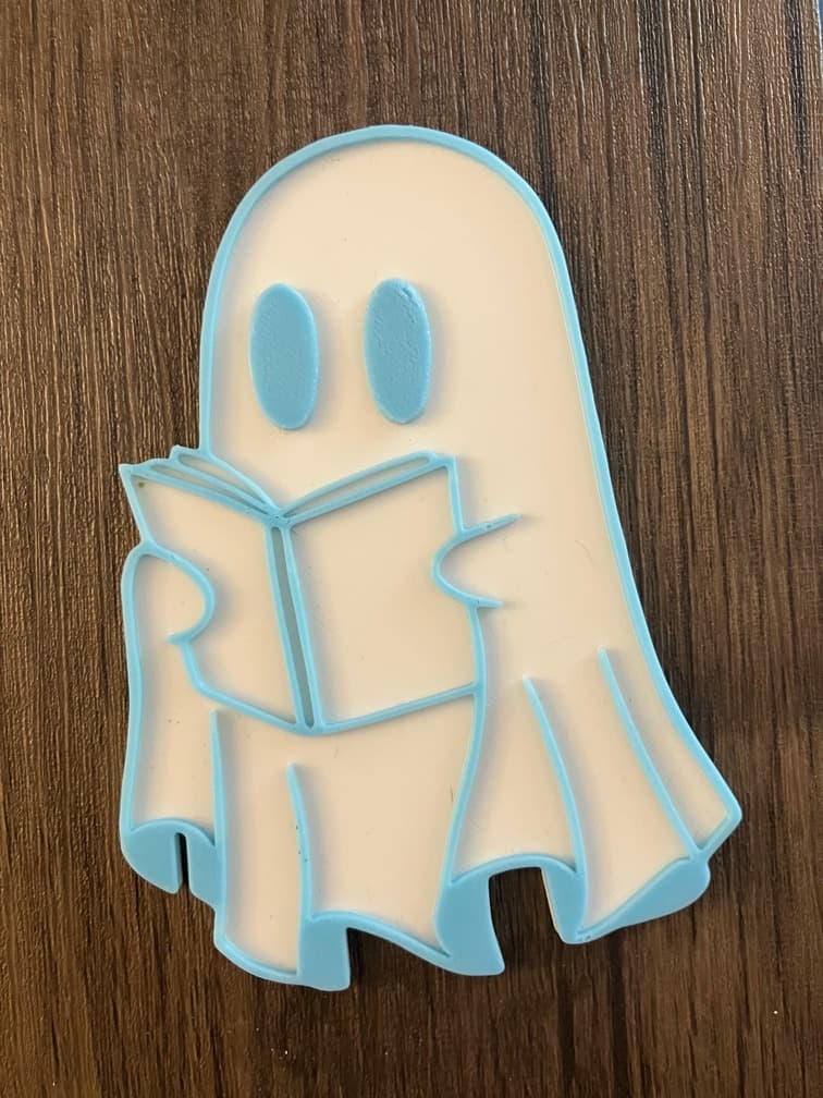 Glow-in-the-dark reading ghost decoration